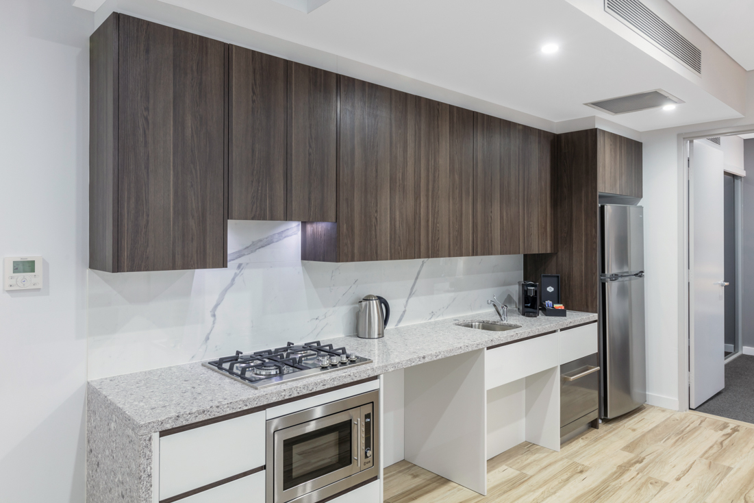 Modern kitchenette in an example disability accommodation setting