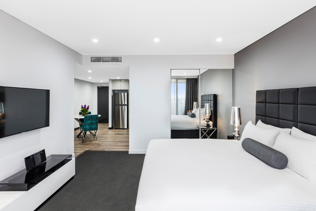 Furnished bedroom in an example short-term accommodation property
