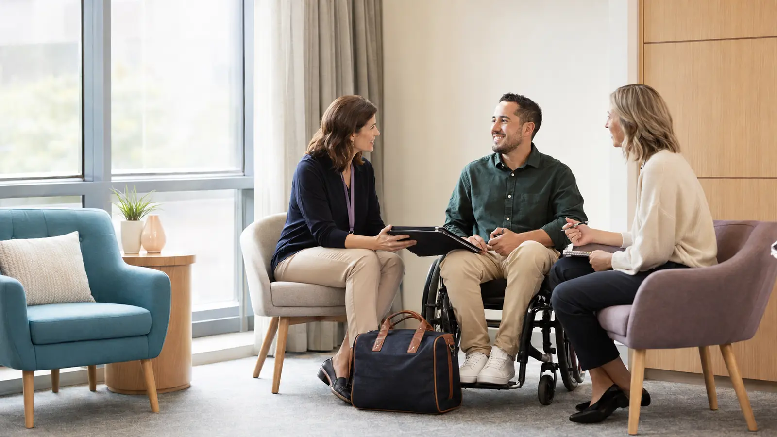 NDIS participant, hospital social worker and support coordinator planning a safe discharge